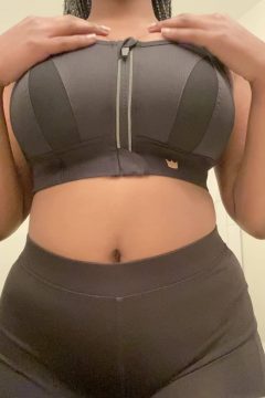 sportive ebony woman with huge black boobs in tight sports bra