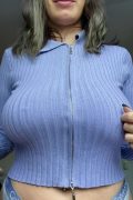 woman with big boobs in braless tight sweater
