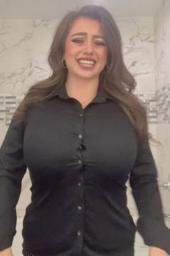 busty woman with huge natural tits in tight shirt