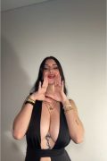 dark hair tiktok girl with big tits and hot lips in a sexy black dress