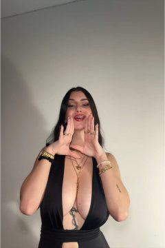 dark hair tiktok girl with big tits and hot lips in a sexy black dress